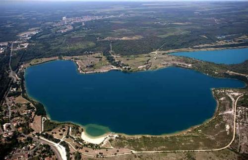 an aerial view of a lake from an airplane at Gite les agreou in Arjuzanx