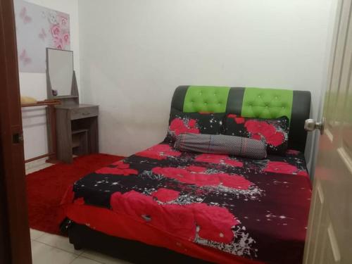 Ένα ή περισσότερα κρεβάτια σε δωμάτιο στο Sinakhan Homestay