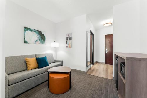 a living room with a couch and a table at Comfort Inn & Suites Tunkhannock in Tunkhannock