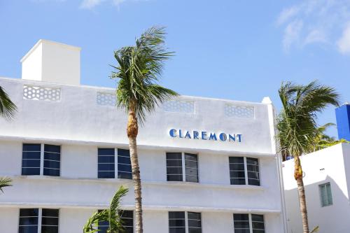 a white building with the sign for the claremont hotel at Claremont Hotel in Miami Beach