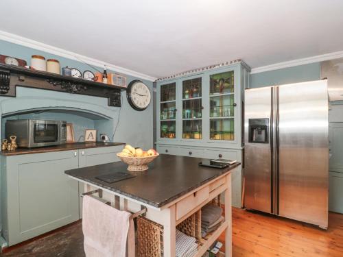 a kitchen with a stainless steel refrigerator and a counter at Humphreston House in Bristol