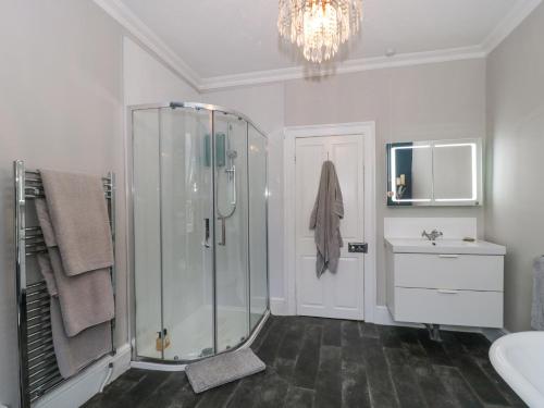a bathroom with a shower and a sink at Humphreston House in Bristol