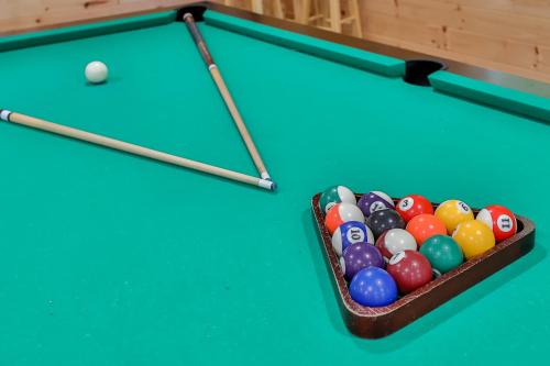 a box of billiard balls on a pool table at Matterhorns Hunter Lodge in Hunter