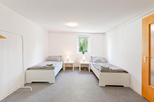 Ένα ή περισσότερα κρεβάτια σε δωμάτιο στο XXL-Apartments Göppingen