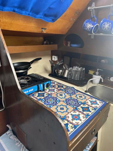 a kitchen counter with a stove and a sink at Hermes in Caleta de Sebo