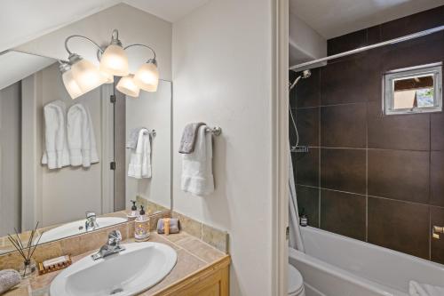 a bathroom with a sink and a tub and a shower at Telluride Resort View at Double Diamond - ski-in-out and hot tub! in Telluride
