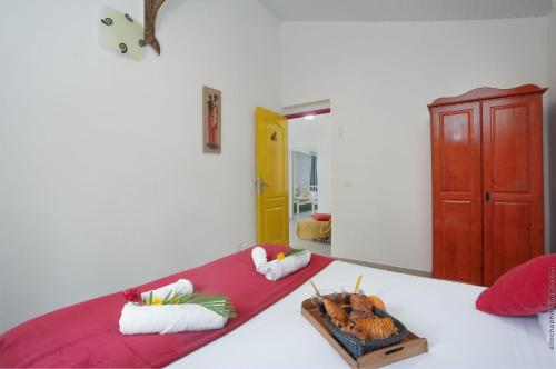 Postel nebo postele na pokoji v ubytování Villa fleur d'éden