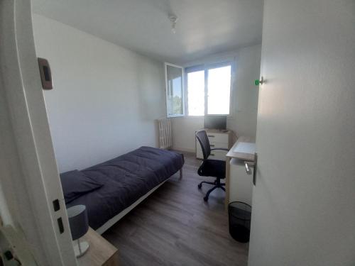 Ένα ή περισσότερα κρεβάτια σε δωμάτιο στο Appartement Le Valmy