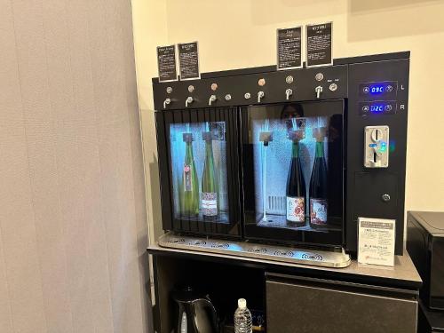a vending machine with bottles of wine in it at Domaine Bless in Niki
