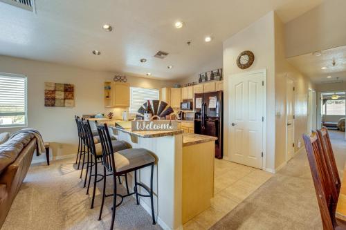 a kitchen with a counter and chairs in a room at 2 Mi to Lake Apt with Balcony in Payson! in Payson