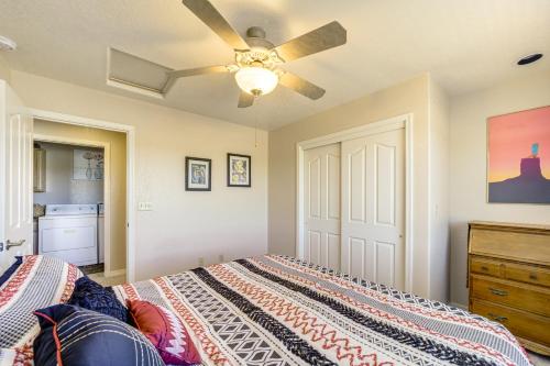 a bedroom with a bed and a ceiling fan at 2 Mi to Lake Apt with Balcony in Payson! in Payson