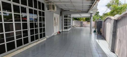 an empty hallway of a house with a garage at Homestay Banglo Tengah Pekan in Alor Setar