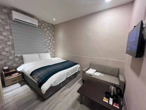 TV a/nebo společenská místnost v ubytování Mu-In Hotel