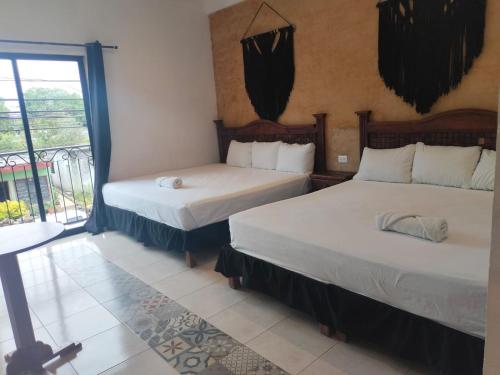 Postel nebo postele na pokoji v ubytování Hotel Casa Henequén