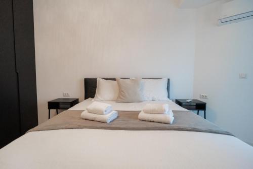 Ένα ή περισσότερα κρεβάτια σε δωμάτιο στο Vulcan Residences - Premium Apartments
