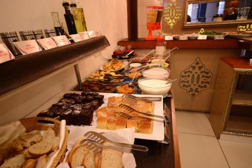a buffet line with many different types of food at Grand Anzac Hotel in Çanakkale