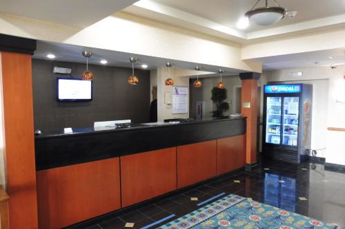 a bar in a restaurant with a drink counter at Red Roof Inn & Suites Galloway in Galloway