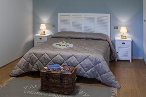 a bedroom with a large bed with two night stands at Casolare Santa Margherita in Assisi