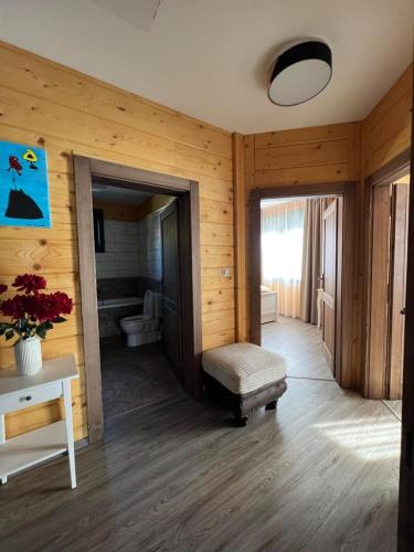 a room with a bathroom with a toilet and a bench at Roubenka Na Číně in Želiv