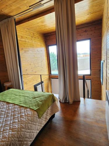 a bedroom with a bed and two windows at Casa Cortés Golf - Exclusivo Adultos - Solo con Reserva y Aceptación de Reglamento in Sierra de la Ventana