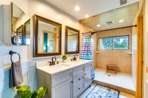 a bathroom with a sink and a shower at Sunny Titusville Retreat Near Space Coast! in Titusville