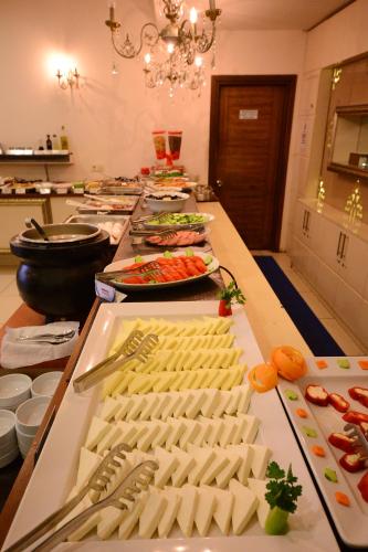 a buffet line with many different types of food at Grand Anzac Hotel in Çanakkale