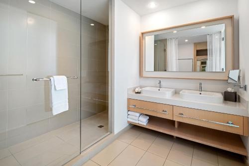 a bathroom with a sink and a mirror at The Grayson Hotel Miami Downtown in Miami