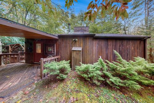 a wooden cabin with a porch and a wooden deck at Andreas Creek Cabin #1 in Boone