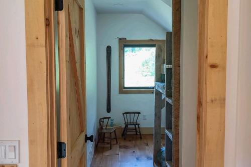 a hallway in a house with a window at The Hollow in Plymouth