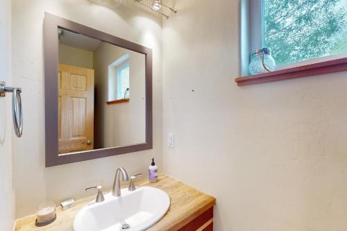 a bathroom with a sink and a mirror at Serene Mountain Escape in Silverthorne