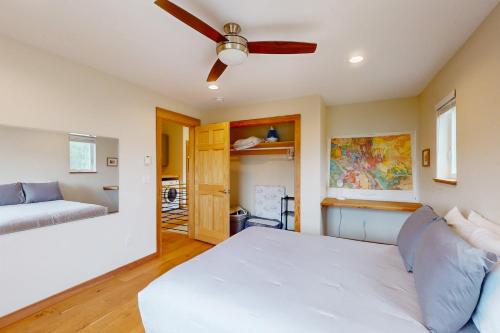 a bedroom with a bed and a ceiling fan at Serene Mountain Escape in Silverthorne