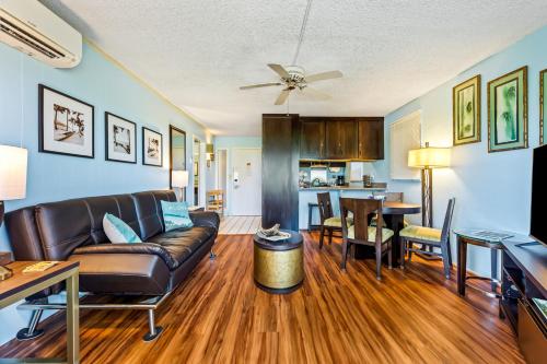 a living room with a couch and a table at Plantation Hale F5 in Kapaa