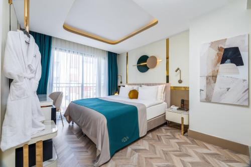 Кровать или кровати в номере Lexia Hotels
