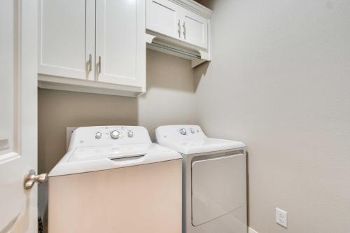 a small kitchen with a washer and dryer at Texas Home with Hot Tub 3 Mi to Downtown Canyon! in Canyon