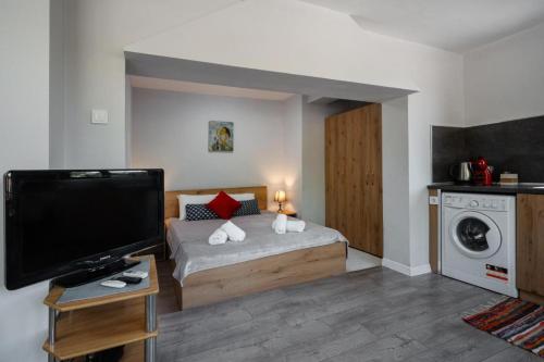 Postel nebo postele na pokoji v ubytování Cozy Apartment Green Terrace