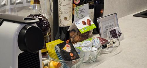 a counter with a bottle of wine and some food at Apartment Holata 401 in Hradec Králové