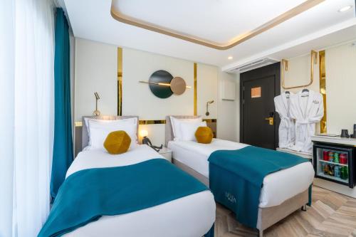 Кровать или кровати в номере Lexia Hotels