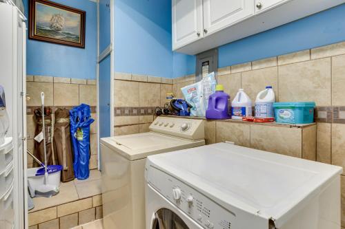 a laundry room with a washer and dryer at Lawton Home with Deck, Near Casinos and Museums! in Lawton