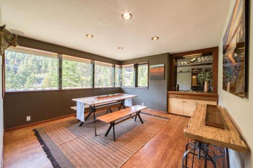 a room with a ping pong table and a bench at Spire Chalet at Alpine Meadows - 4BR W Hot Tub and Ski Shuttle in Alpine Meadows