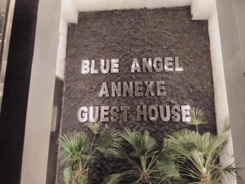 a sign that reads blue angel amaze guest house at BLUE ANGEL Guest House in Shillong