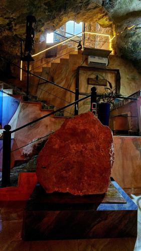 a large rock sitting on a table in a cave at Sunset Samana in Las Galeras