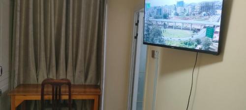 TV a/nebo společenská místnost v ubytování Sky Nest 14
