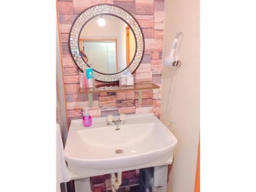 a bathroom with a sink and a mirror at Guest House Terrace Sakashita - Vacation STAY 46671v in Naha