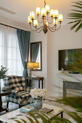 a living room with a couch and a table at Villa Đà Lạt Khởi Nghĩa Bắc Sơn Gần Hồ Xuân Hương Gần Chợ Đêm - KNBS Lana in Xuan An