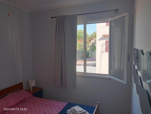 Een bed of bedden in een kamer bij Marina di Ragusa House Relax