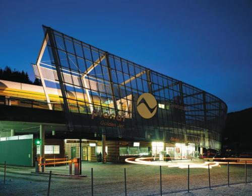 a building with a sign on the side of it at Ferienhaus JOLOISIA mit Blick auf Planai in Schladming