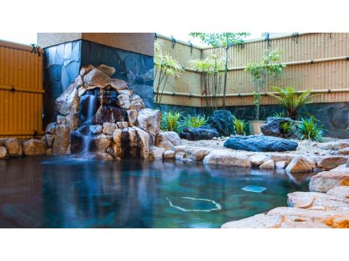 a water feature in a yard with a waterfall at Sansuien - Vacation STAY 06800v in Kochi