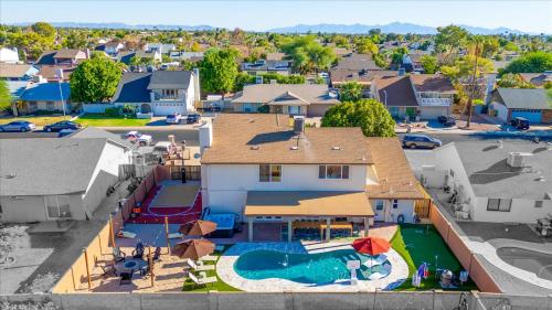 an aerial view of a house with a swimming pool at Slide into Fun Pool Games Fire Pit Sport Court in Glendale