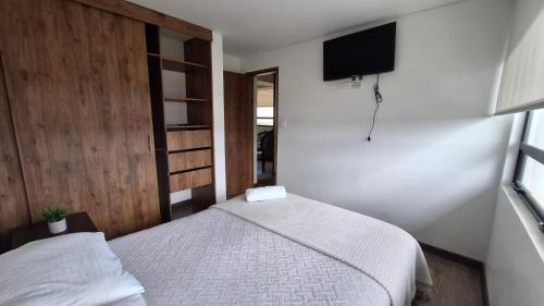 Letto o letti in una camera di Caminos del Dorado sede Apartamento