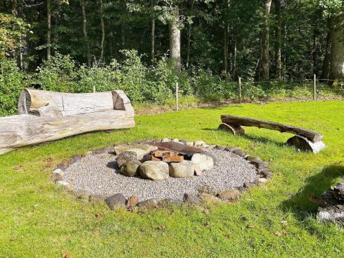 a fire pit in the middle of a field at 6 person holiday home in Brålanda-By Traum in Brålanda